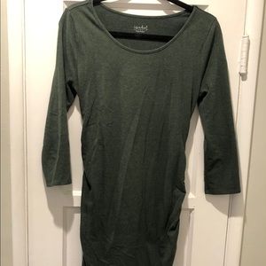 Fitted, rouched, green maternity dress.